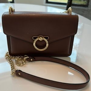 Rebecca Minkoff cross body leather handbag in light brown with gold details.